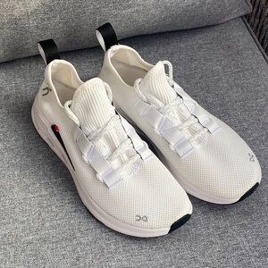 On Running White and Black Athletic Shoes